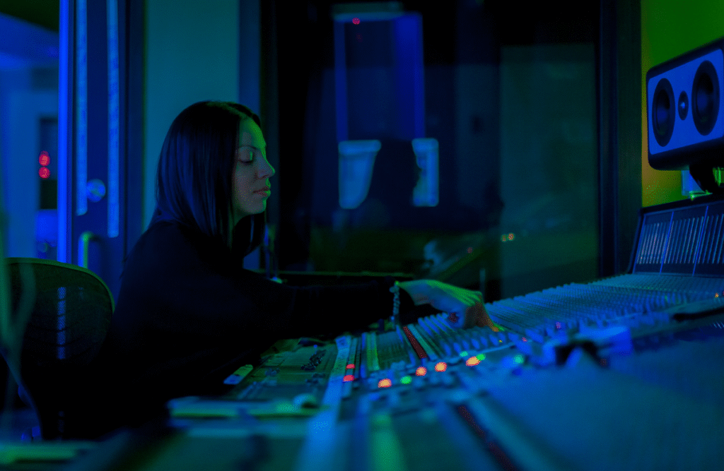 a sound engineer mixing sound in a studio